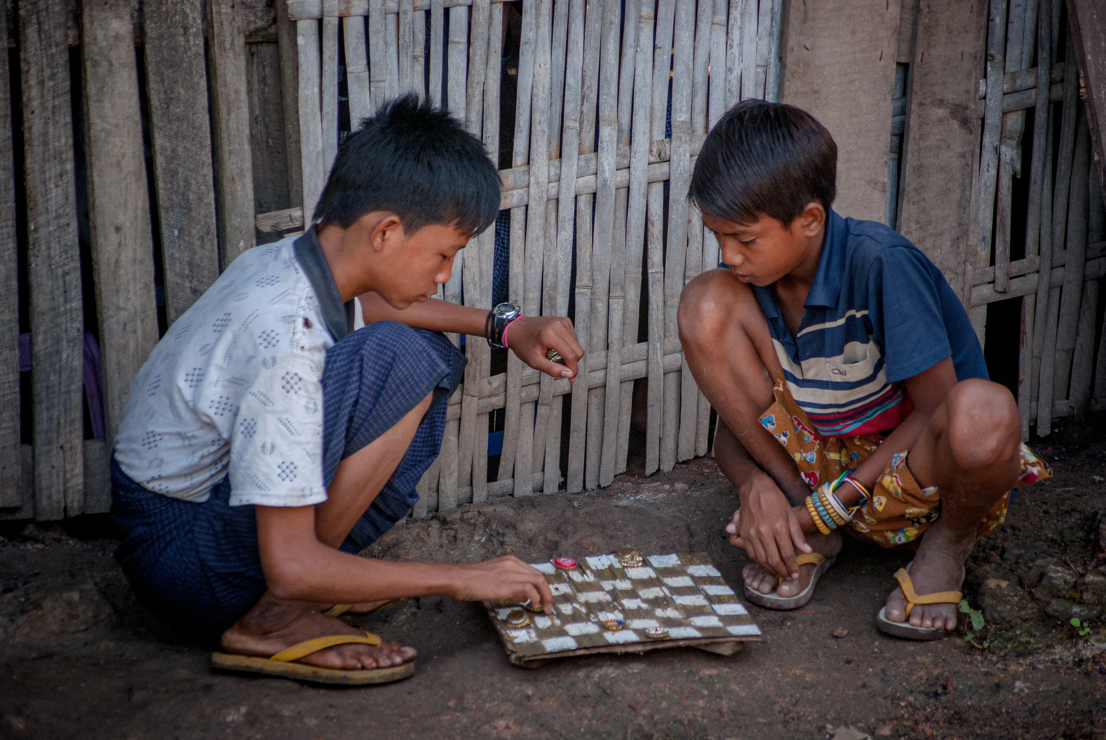 People playing a board game around a table