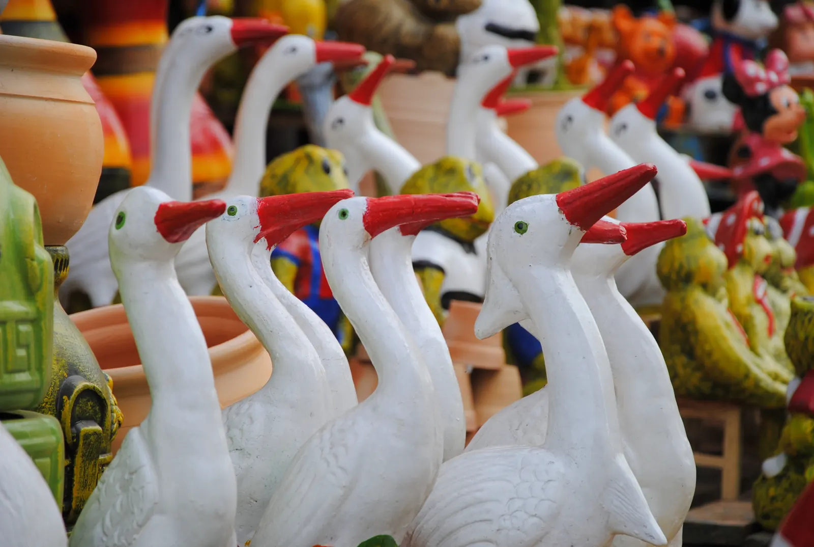 Hand-painted ceramic herons and other pottery for sale in Areguá, Paraguay