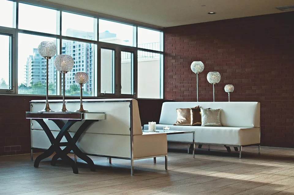 Furnished apartment living room with sofas and large windows