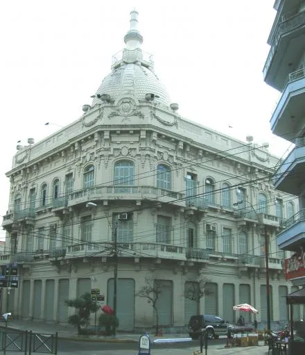 Historic white Ministerio de Hacienda building with corner cupola in downtown Asunción