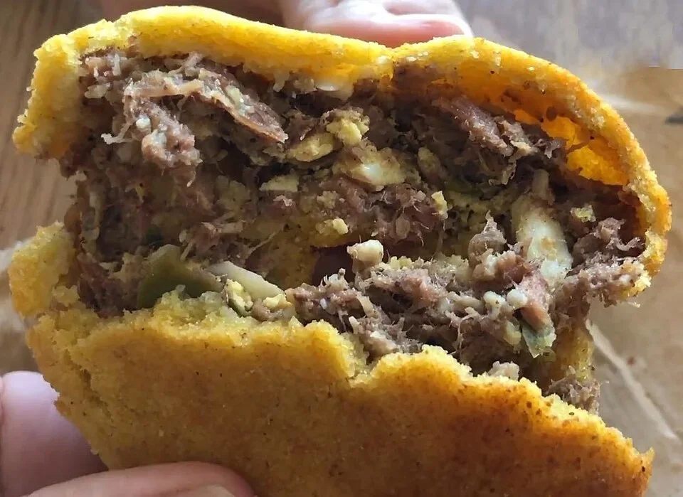 Chipa so’o with its meat filling, photographed at Hijas de Feliciana de Fariña in 2020.