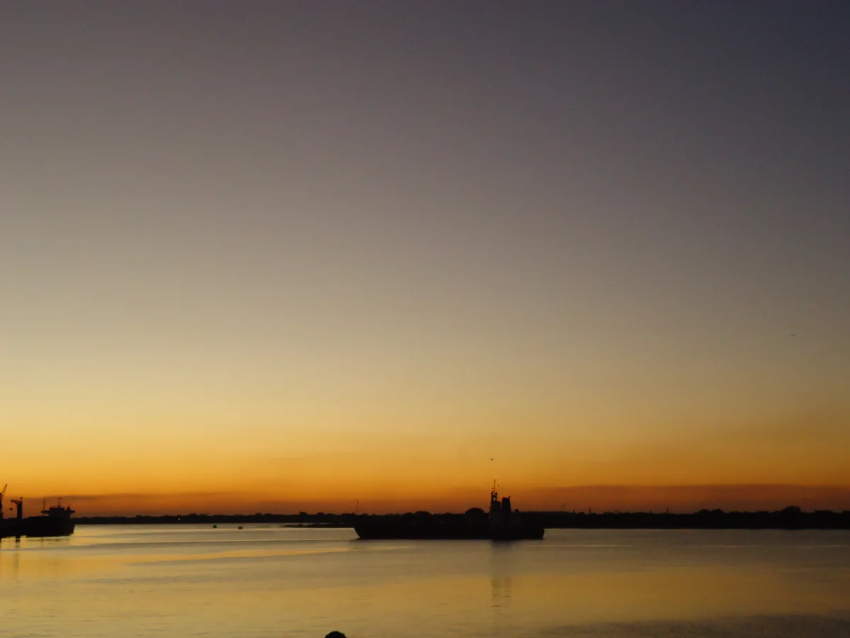 Golden dusk over the Bahía de Asunción, with ships in silhouette