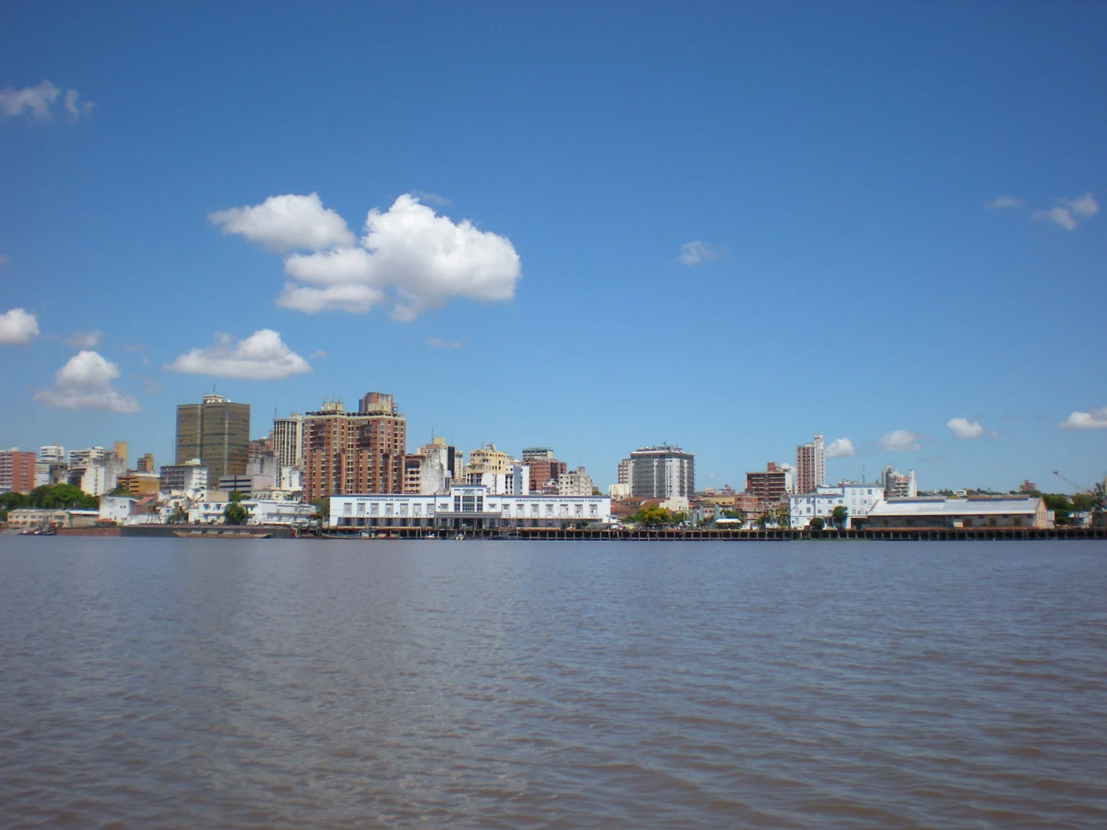 The historic white port building and Asunción skyline seen across the Paraguay River in March 2011.