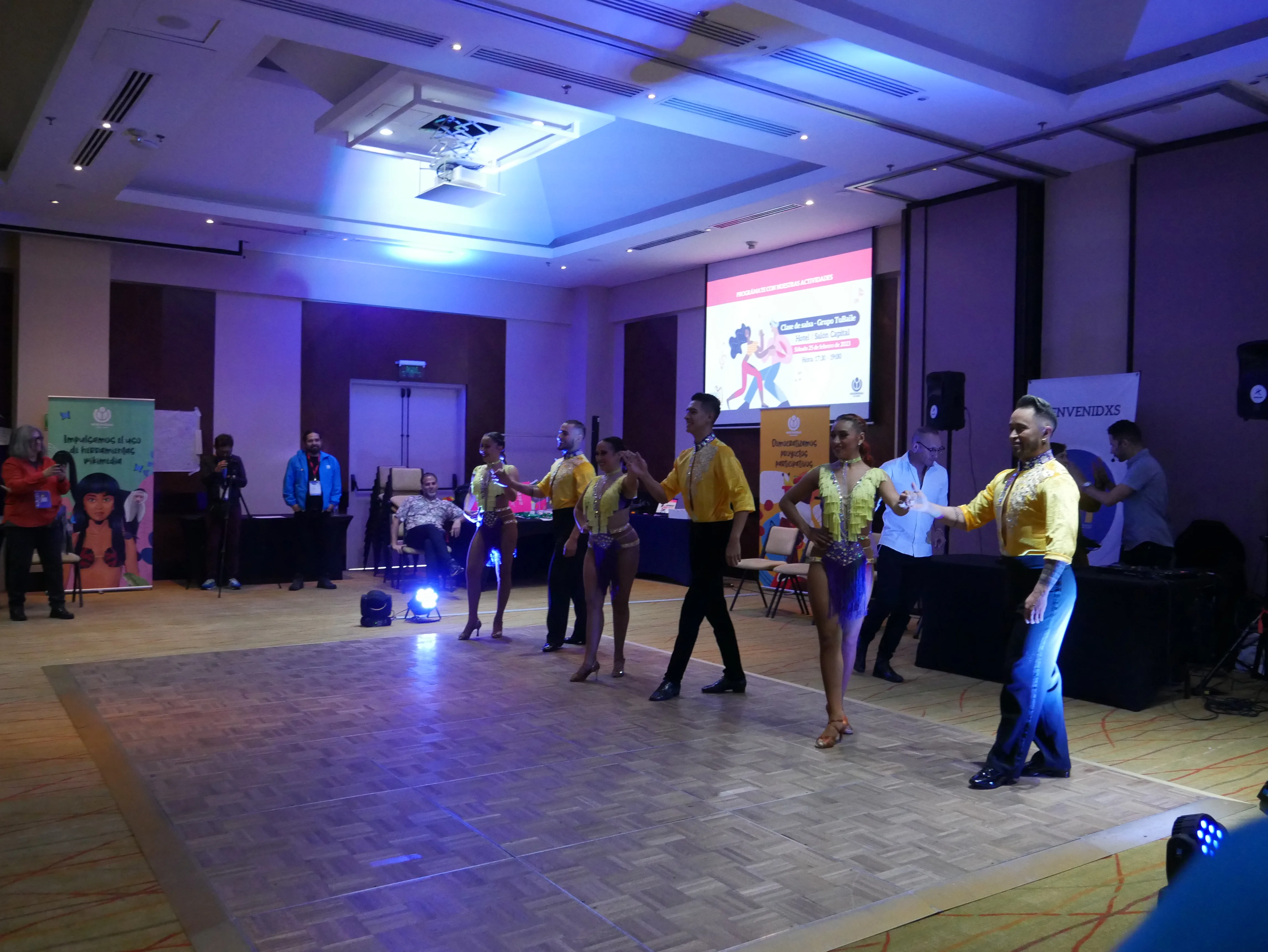 A salsa class in progress with dancers in a line
